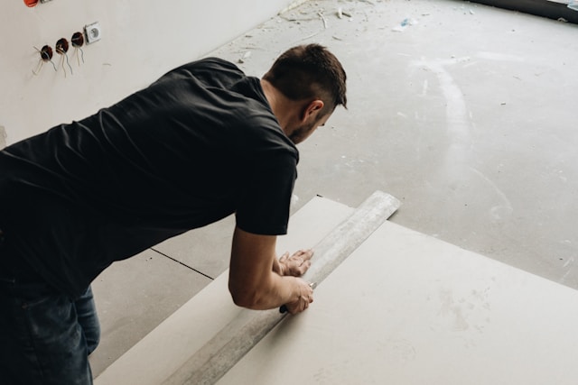 Person measuring floor
